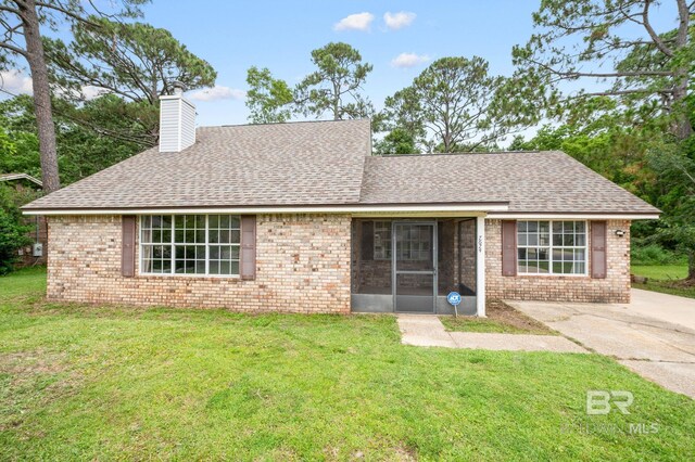 ranch-style house with a front lawn