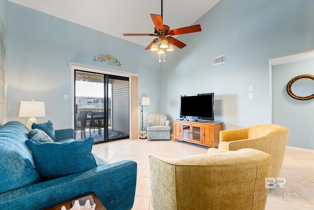 living room featuring light tile patterned flooring, a towering ceiling, and ceiling fan