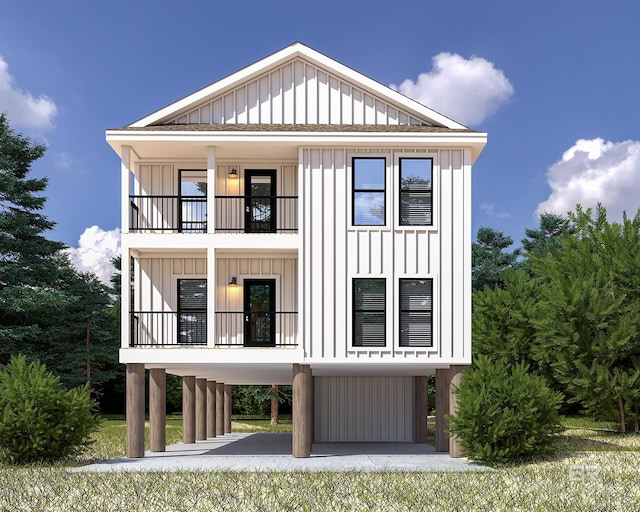 view of front of home featuring a carport and a balcony