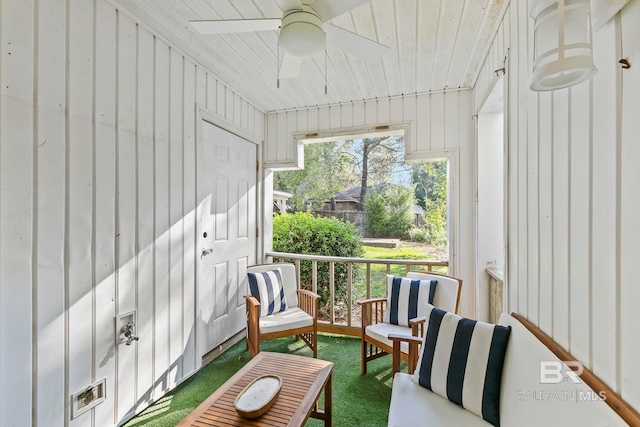 sunroom / solarium with ceiling fan