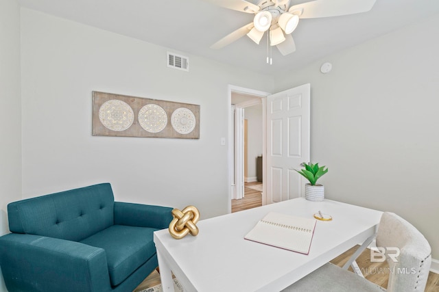 home office featuring ceiling fan and hardwood / wood-style floors