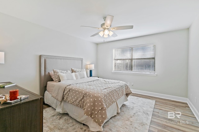 bedroom featuring light hardwood / wood-style floors and ceiling fan