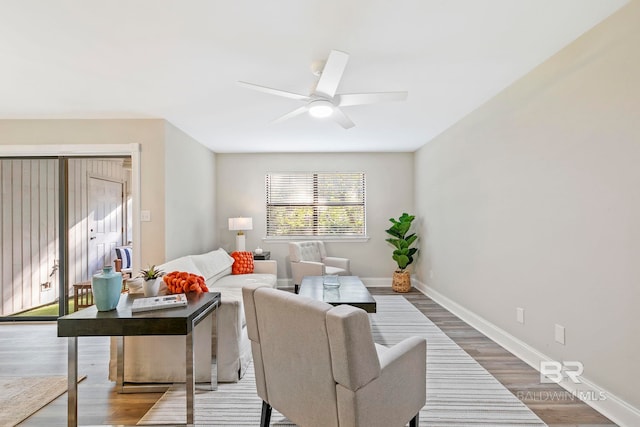 living room featuring light wood-type flooring and ceiling fan