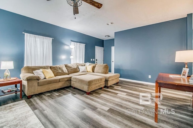 living room with ceiling fan and hardwood / wood-style floors