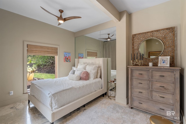 bedroom featuring a ceiling fan and baseboards