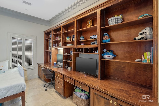 office space featuring visible vents, ornamental molding, and built in desk