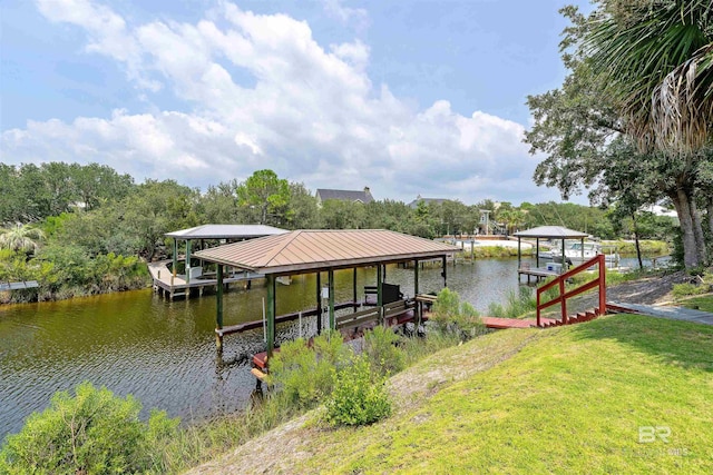 view of dock featuring a lawn, a water view, and boat lift