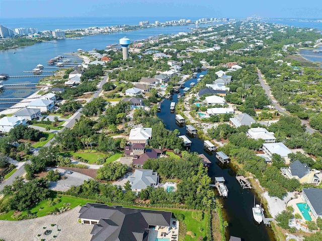 birds eye view of property with a residential view and a water view