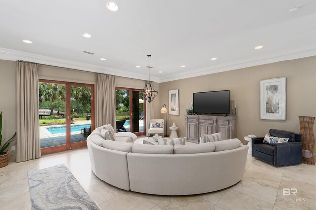 living room with recessed lighting, visible vents, and crown molding