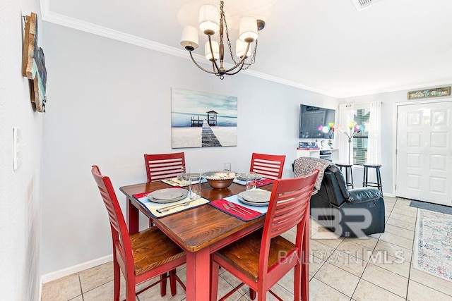 dining room featuring a chandelier, light tile patterned flooring, crown molding, and baseboards