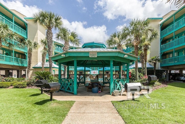 view of property's community featuring a gazebo and a lawn