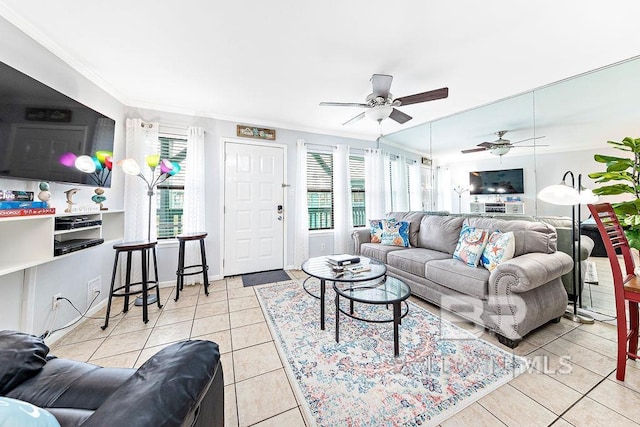 tiled living area featuring crown molding and ceiling fan