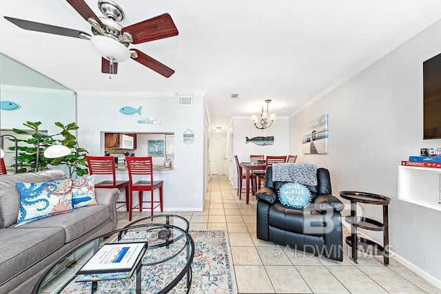 living area featuring a chandelier, crown molding, light tile patterned flooring, baseboards, and a ceiling fan