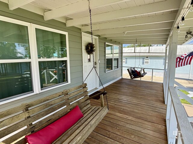 wooden terrace featuring a porch