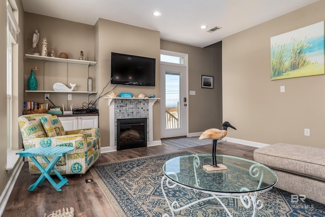 105 Strand Ct, Dauphin Island, AL 36528 - living room featuring visible vents, recessed lighting, baseboards, dark wood-style flooring, and a tile fireplace