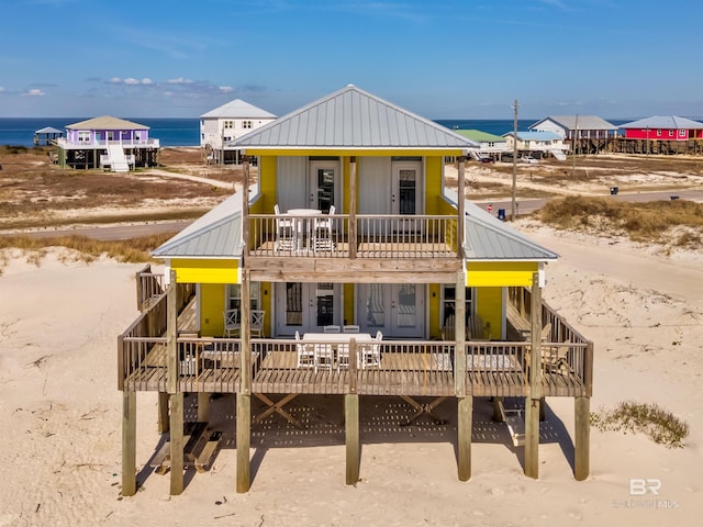 view of front of property with a water view and metal roof