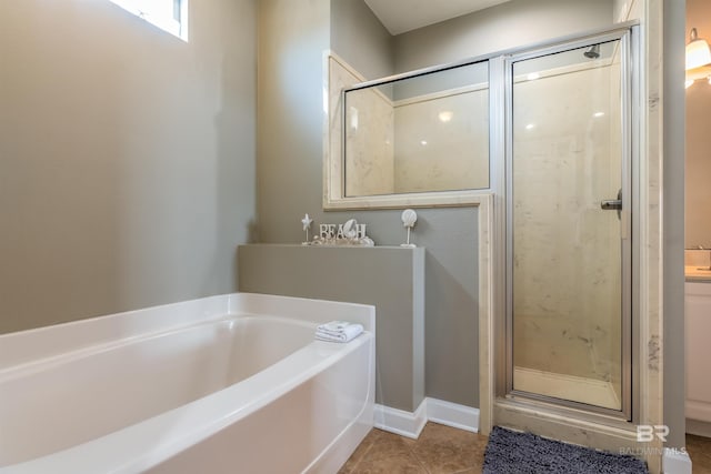 105 Strand Ct, Dauphin Island, AL 36528 - full bath featuring tile patterned floors, a garden tub, and a stall shower