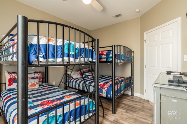 105 Strand Ct, Dauphin Island, AL 36528 - bedroom with visible vents, baseboards, ceiling fan, and wood finished floors