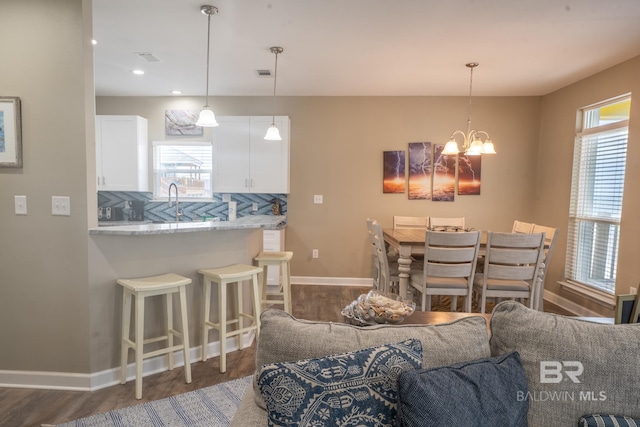 105 Strand Ct, Dauphin Island, AL 36528 - dining area with visible vents, baseboards, recessed lighting, dark wood-style flooring, and a chandelier