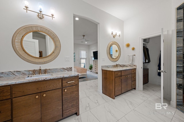 bathroom featuring ceiling fan and vanity