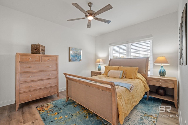 bedroom with ceiling fan and hardwood / wood-style floors