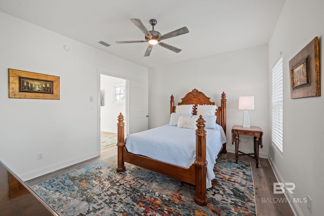 bedroom with hardwood / wood-style floors and ceiling fan