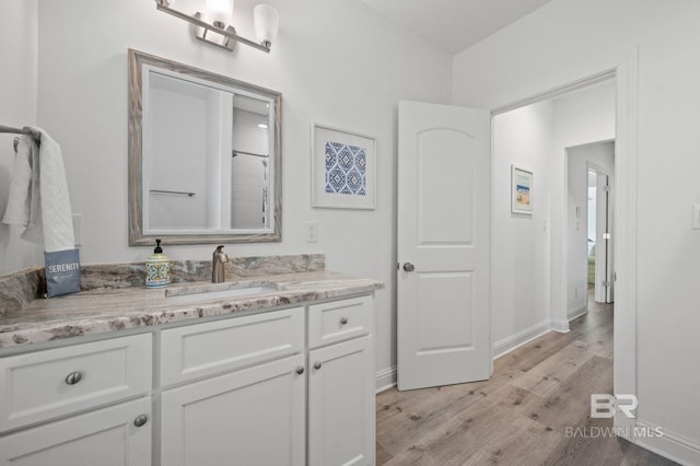 bathroom featuring vanity and wood-type flooring