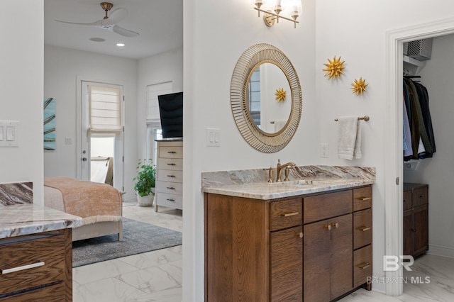 bathroom featuring vanity and ceiling fan