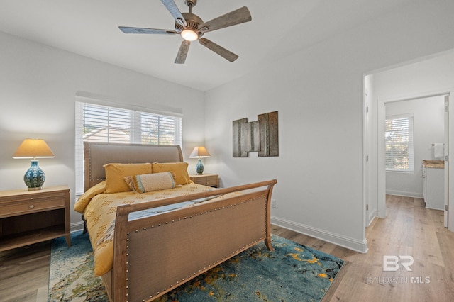 bedroom with ceiling fan and light hardwood / wood-style flooring