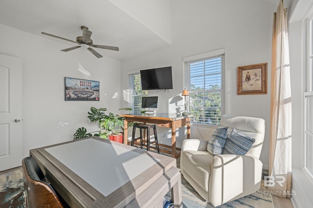 home office featuring light hardwood / wood-style floors and ceiling fan