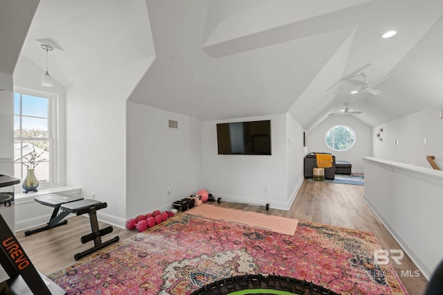 interior space with light hardwood / wood-style floors and lofted ceiling