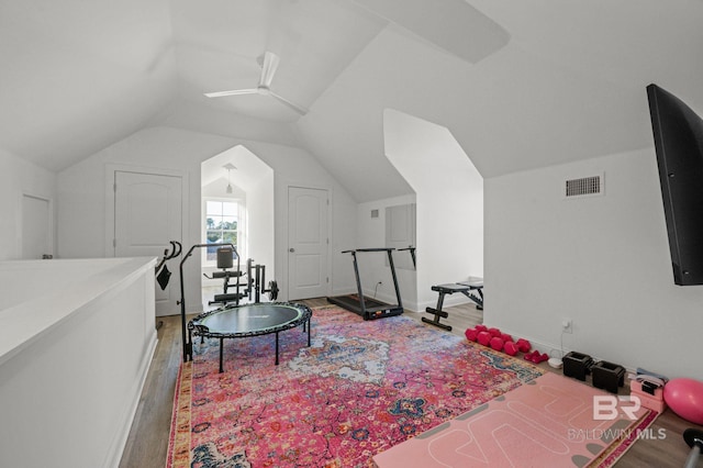 interior space with ceiling fan, hardwood / wood-style floors, and vaulted ceiling