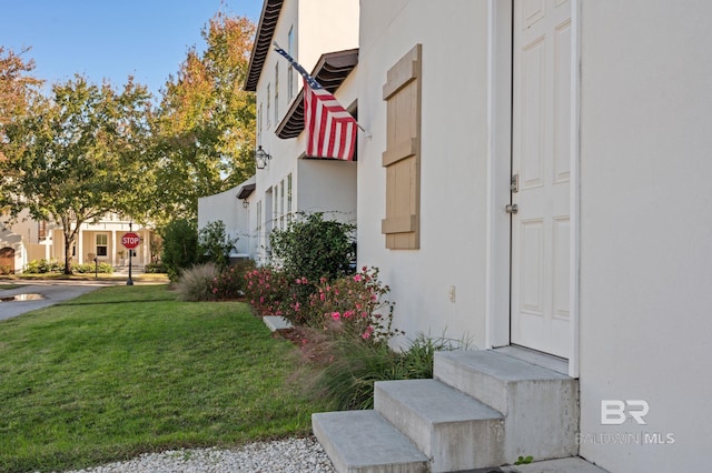 view of side of home featuring a yard