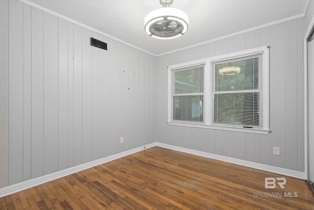 409 E Byron Ave, Mobile, AL 36609 - empty room with wood finished floors, crown molding, and a chandelier