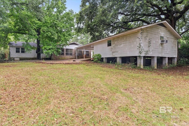 409 E Byron Ave, Mobile, AL 36609 - rear view of house with a yard