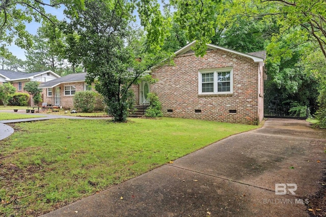 409 E Byron Ave, Mobile, AL 36609 - view of front of property featuring crawl space, brick siding, a front lawn, and driveway