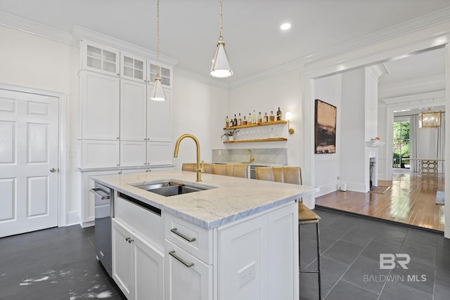 kitchen with a center island with sink, sink, white cabinets, and dark hardwood / wood-style floors