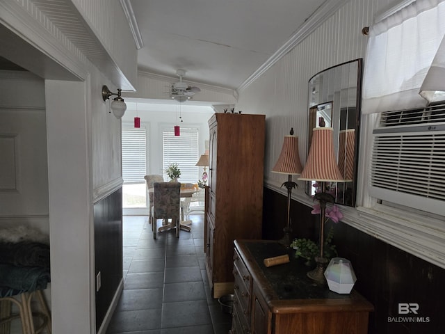 kitchen featuring a ceiling fan and crown molding