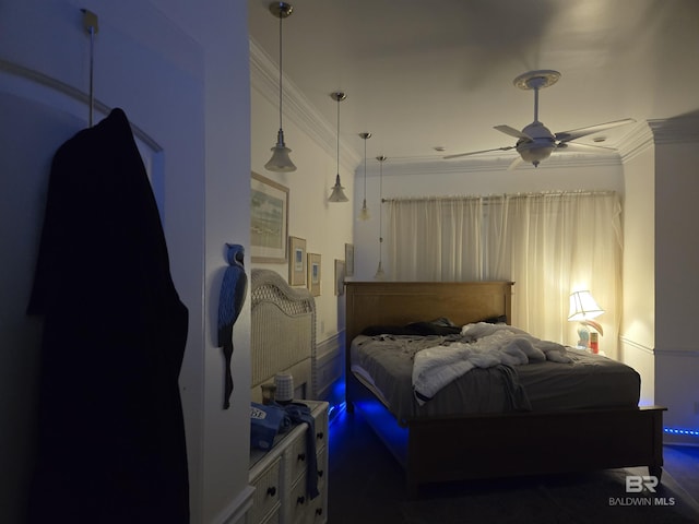 bedroom with ornamental molding and a ceiling fan