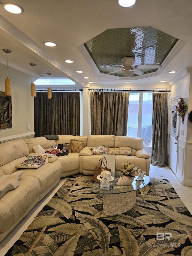 living room featuring ceiling fan, light tile patterned flooring, recessed lighting, ornamental molding, and a raised ceiling