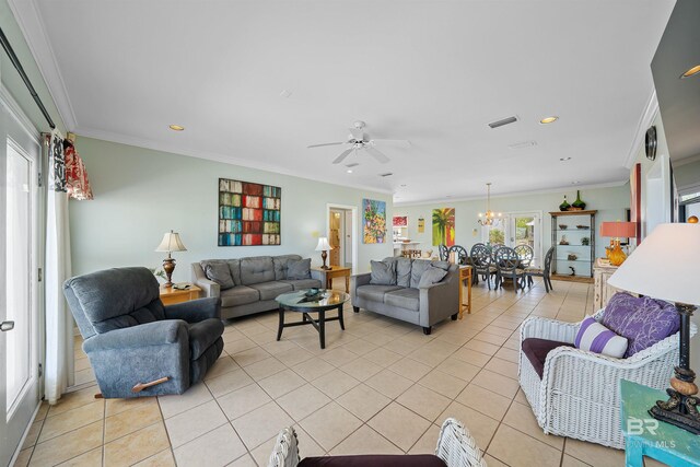 307 Audubon Pl, Dauphin Island, AL 36528 - living room featuring light tile patterned floors, ornamental molding, ceiling fan with notable chandelier, and visible vents