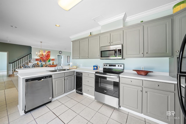 307 Audubon Pl, Dauphin Island, AL 36528 - kitchen with wine cooler, a peninsula, gray cabinets, a sink, and appliances with stainless steel finishes