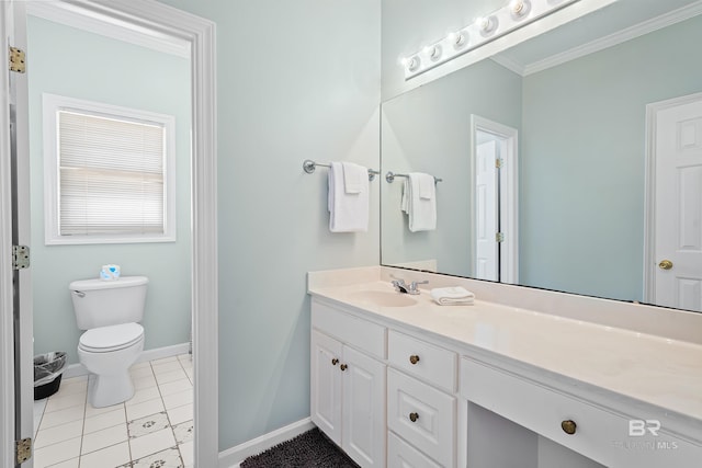 307 Audubon Pl, Dauphin Island, AL 36528 - bathroom with crown molding, vanity, baseboards, tile patterned floors, and toilet