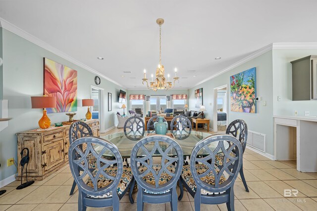307 Audubon Pl, Dauphin Island, AL 36528 - dining room with light tile patterned floors, crown molding, visible vents, and a chandelier