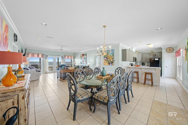307 Audubon Pl, Dauphin Island, AL 36528 - dining area with light tile patterned flooring, recessed lighting, ornamental molding, and ceiling fan with notable chandelier