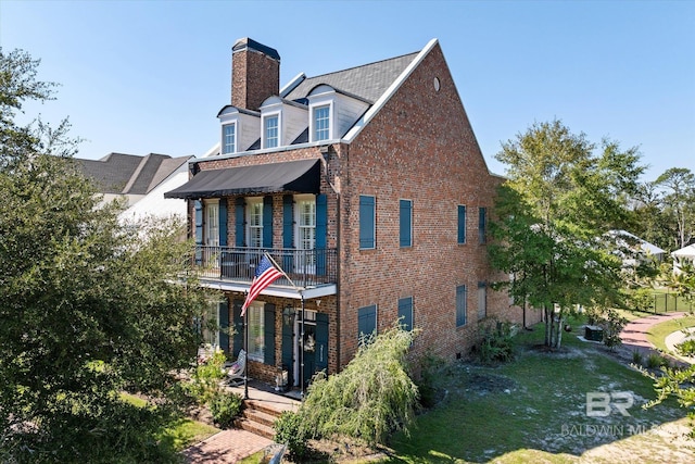 view of front of home with a balcony