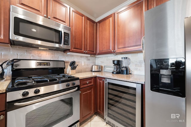 kitchen featuring light stone counters, stainless steel appliances, light tile patterned floors, decorative backsplash, and beverage cooler