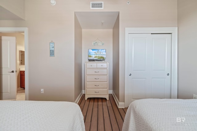 bedroom featuring a closet and light hardwood / wood-style floors