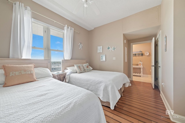 bedroom with hardwood / wood-style flooring and ceiling fan