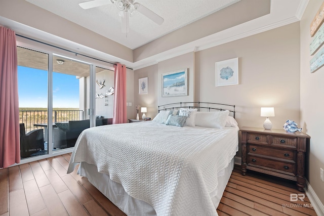 bedroom with ceiling fan, access to exterior, and hardwood / wood-style floors